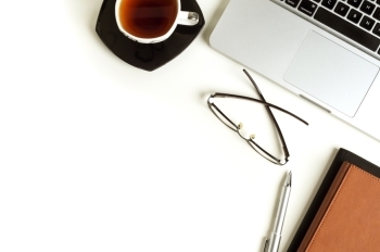 laptop and coffee on table